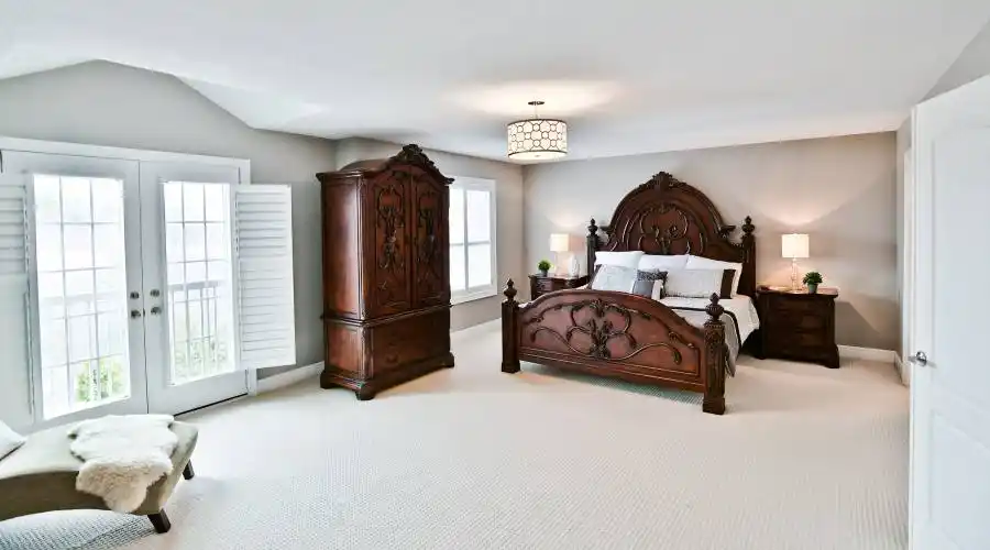 Master Suite with juliette balcony overlooking lush ravine